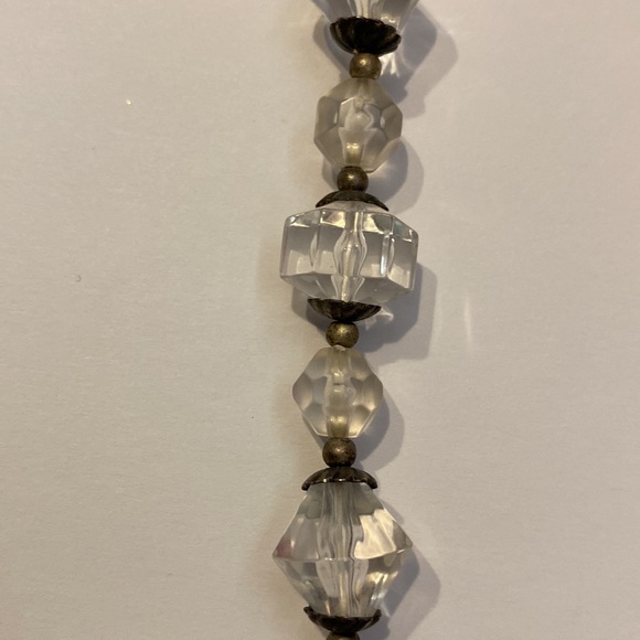 Acrylic faceted clear beads with silver color spacers strung on string c clasp - Picture 2 of 3